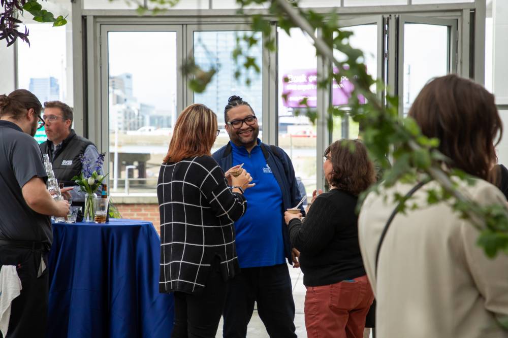 Robert Shorty chatting with two other colleagues